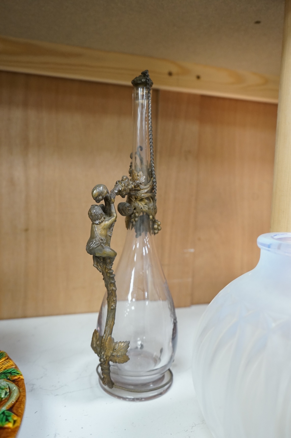 A glass decanter with bronzed metal mount, and a Sabino opaline glass vase, decanter 36cm high